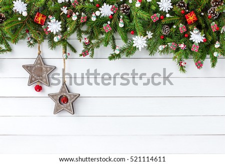 Christmas background. Decorated Christmas fir tree branch with  on white wooden board background. Top view, copy space 