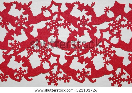 Red fabric Christmas pattern in white background with reindeer, stars and snow flakes