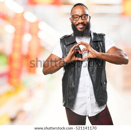 black man doing a heart symbol