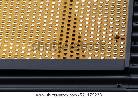 Details of modern architecture, yellow and grey panels on  building facade.