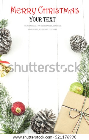 Christmas background with decorations and gift box on white wooden board. Christmas border with decoration ornaments. Top view of christmas border.Traditional christmas decoration with copy space. Royalty-Free Stock Photo #521176990