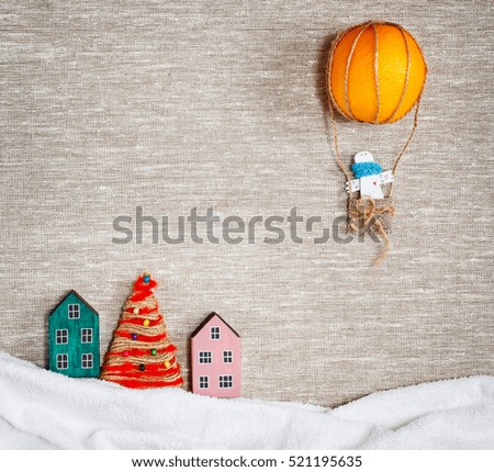 New year and Christmas card. Holiday and celebration concept.  Angel in an Air balloon of orange