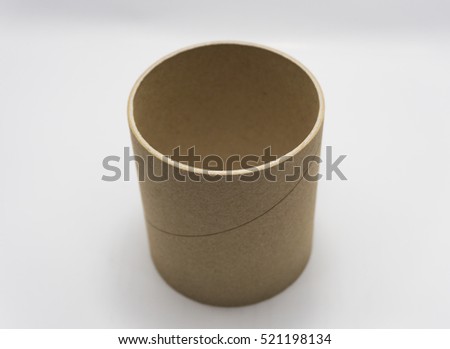 Paper tube of toilet paper on white background.