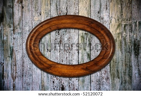 blank photoframe on old wooden background
