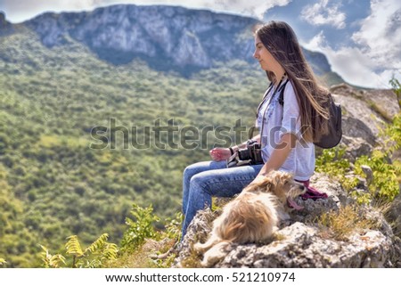 The woman at the top of the mountain looking nature