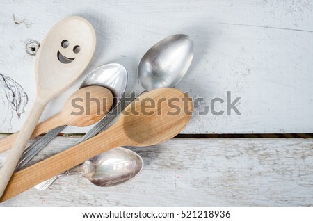 One spoon with smiley face standing with the crowd - individuality. Leadership, uniqueness, independence, initiative, dissent, think different, success, happiness, smile, positivity concept.