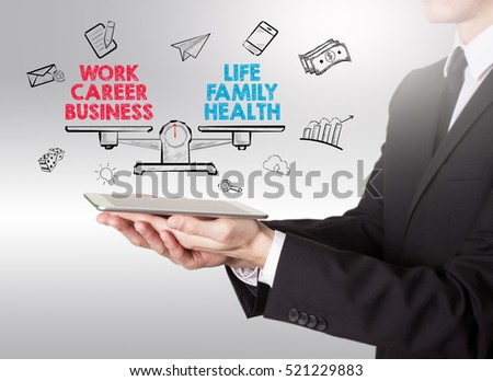 Work Life Balance, young man holding a tablet computer Royalty-Free Stock Photo #521229883