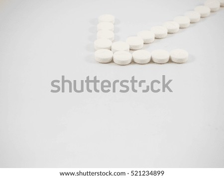 Arrow made of pills. Pharmacy research and development concept. Copy space.