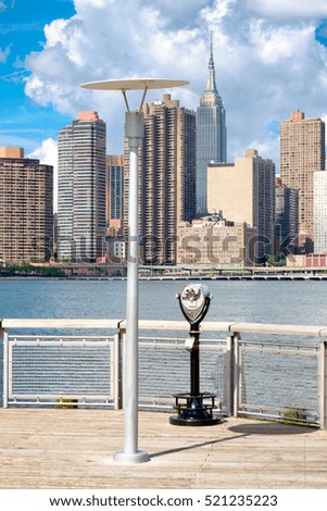 View of the midtown Manhattan skyline in New York on a beautiful summer day from a pier in Queens