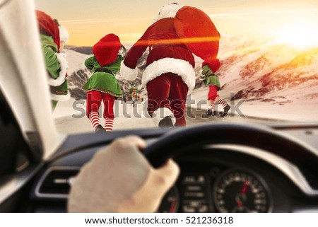 santa claus and elf on road and car interior 