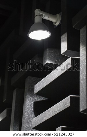 Background of studio sound dampening acoustical foam and LED light. Music room. Soundproof room. Low key photo.