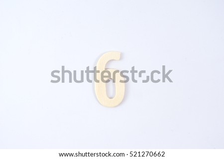 Wooden number sixth on white background