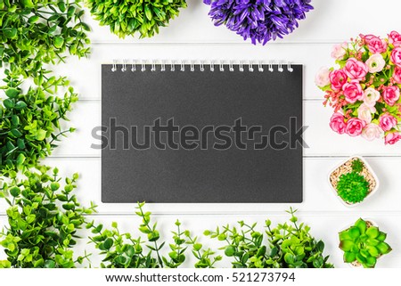 Top view cute flower and nature business desk mock up photography with white wood background.
