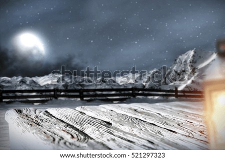 wooden desk space and winter background 