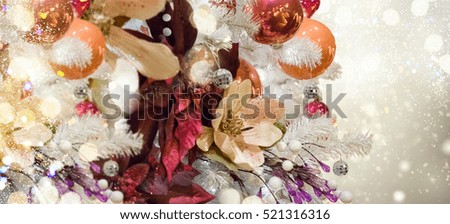 christmas white tree with holiday red and orange decorations and lights banner