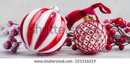 red and white christmas - decorations on aged wooden background with copy space banner