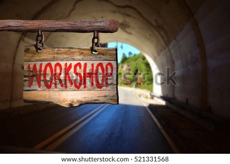 Workshop motivational phrase sign on old wood with blurred background