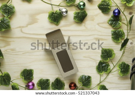 Green leave and product box on wood backgrond in copy space