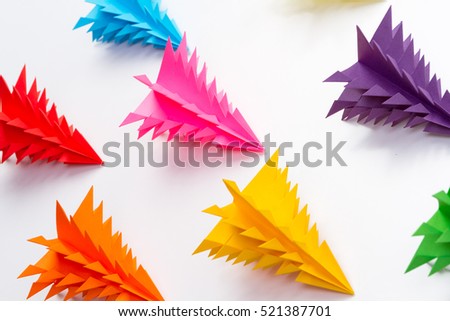 Colorful Christmas tree made of paper on white background