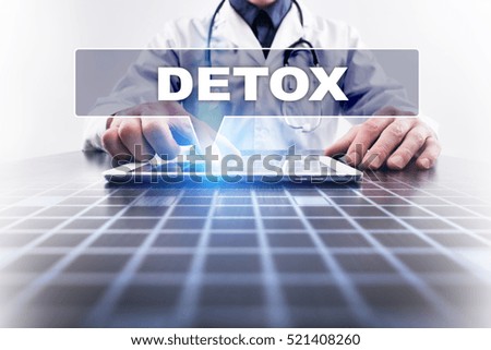 Medical doctor working with modern computer and selecting detox. Medical concept.