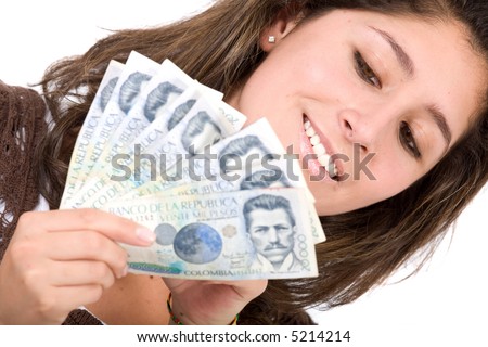 beautiful girl with lots of money - colombian pesos is the currency she is holding