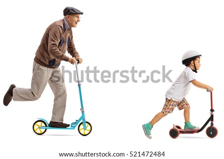 Full length profile shot an elderly man and a little boy riding scooters isolated on white background Royalty-Free Stock Photo #521472484