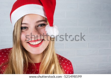 Beautiful blonde woman in Santa hat