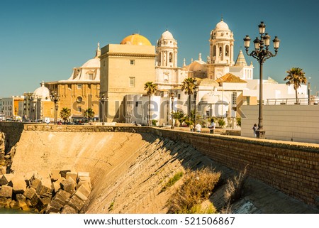 Beautiful view of Cadiz with cathedral and Iglesia Santa Cruz. Bright travel picture of sunny Andalusia.