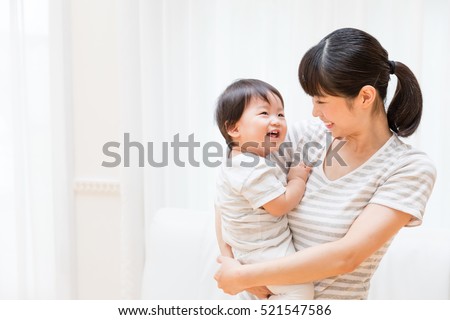 portrait of asian mother and baby lifestyle image Royalty-Free Stock Photo #521547586