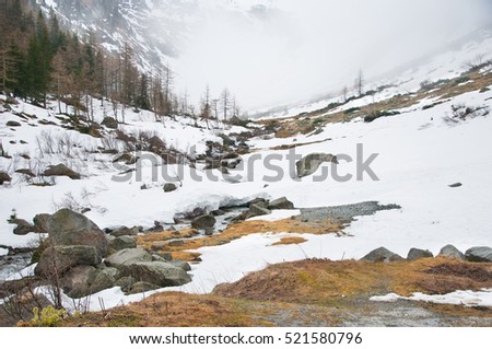 Scenic picture-postcard view of famous place, Grossglockner mountain with cloud & fog, Austria