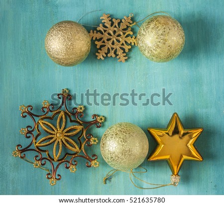 Christmas background with copyspace. A photo of vintage style decorations on a teal blue wooden texture with a place for text