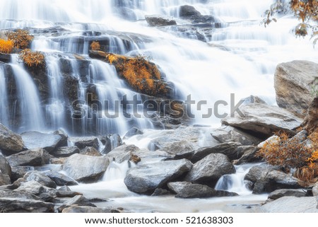 Waterfall in rainforest at northern part of Thailand , autumn landscape