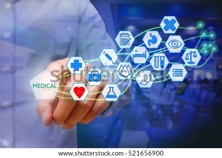 Asian young man pressing medical icon on virtual screen. Healthcare concept.