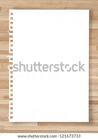White paper sheet on wooden texture.