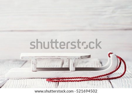 White wooden sledge with red cord, Christmas concept