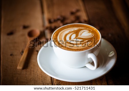 coffee cup latte art Royalty-Free Stock Photo #521711431