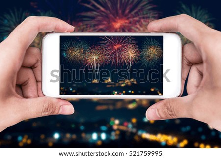 Making photos by smart phone of Beautiful firework display for celebration