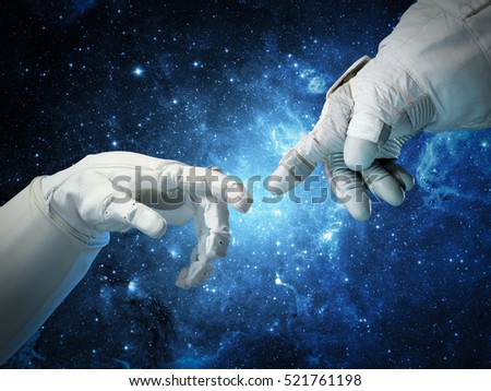 Astronaut hands and on outer space background. Elements of this image furnished by NASA.