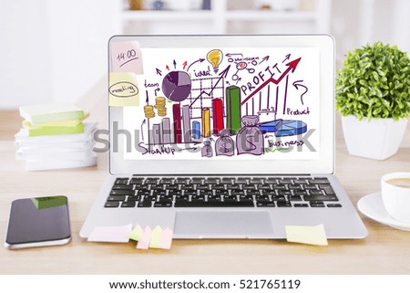 Creative designer desktop with creative business sketch on notebook screen