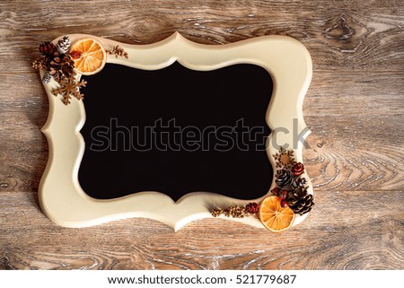 Christmas frame on wooden background with retro decoration 