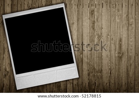 photo frame on wood background with copy space