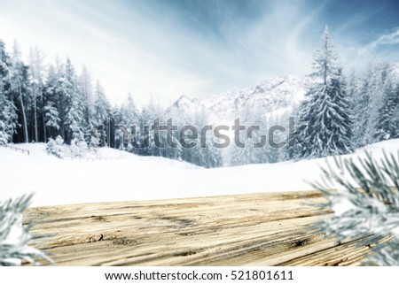 wooden table of free space and winter landscape 