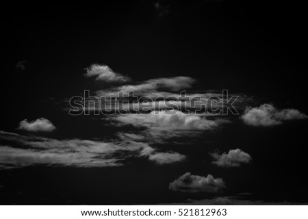 Single white cloud isolated on black background and texture. Brush cloud black background. dark cloud. Royalty-Free Stock Photo #521812963