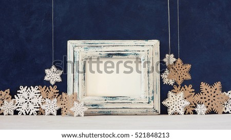 Christmas decoration and photo frame on the blue vintage background. Paper decoration and frame for quotes. New year greeting card template. Holiday mock up. Scandinavian style.