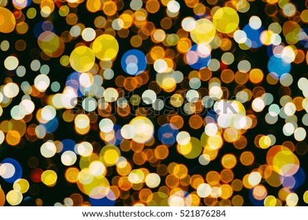 Christmas background. Festive abstract background with bokeh defocused lights and stars 