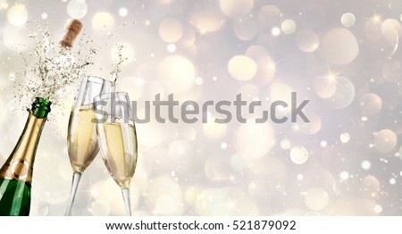 Champagne Explosion With Toast Of Flutes
 Royalty-Free Stock Photo #521879092