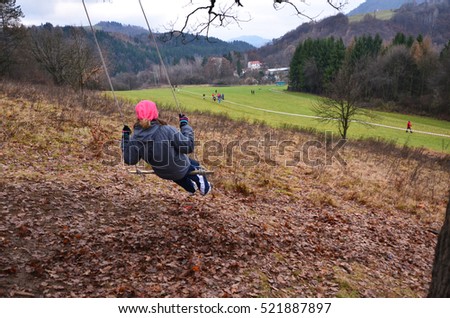 Young girl looking to the runners on the cross country track during professional competition - sport wallpaper with space for your montage. Photo concept for orienteering running,