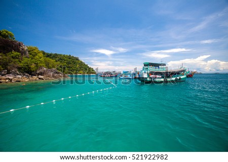 people snorkeling in the deep blue sea ocean of Andaman sea