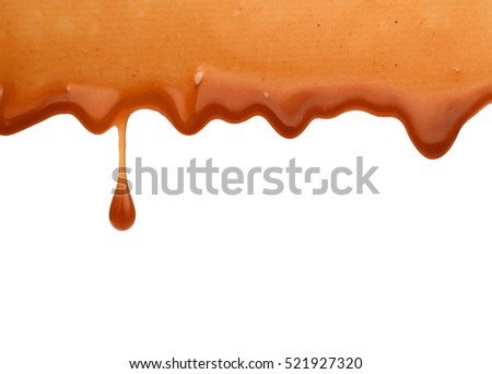 Caramel candies and caramel topping isolated on a white background.