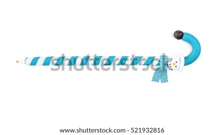 Pen in the shape of a Christmas candy on a white background.